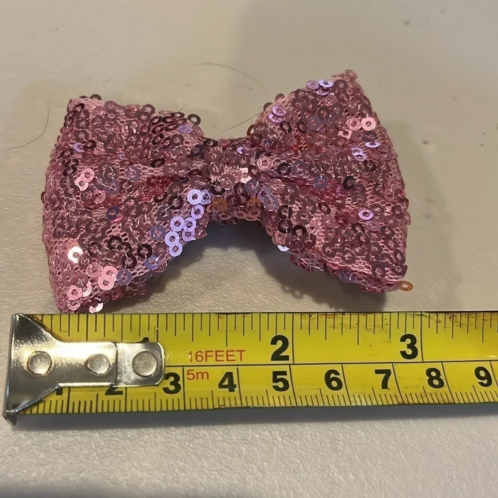 Set of 7.  Girls hair bows.  Alligator clips. 3 inches long.  Sparkly